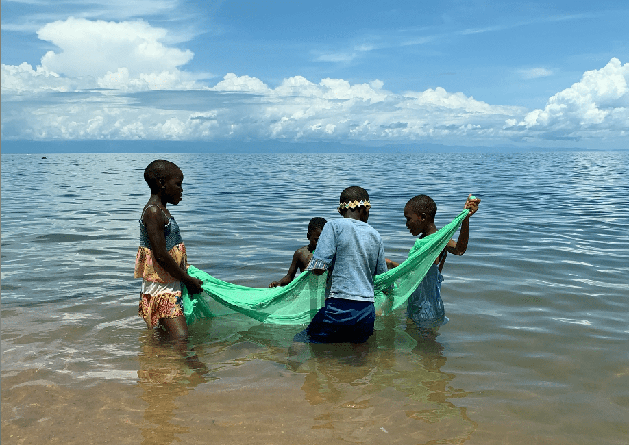 Children fishing in Lake Malawi
