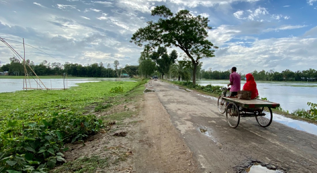 Couple biking in Dhaka, Bangladesh